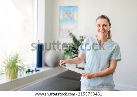 Modern rehabilitation physiotherapy woman worker at job with