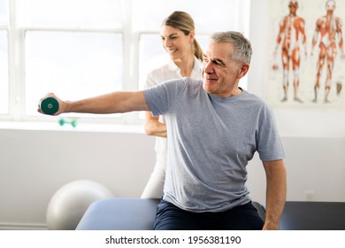 Modern rehabilitation physiotherapy worker with senior client - Powered by Shutterstock