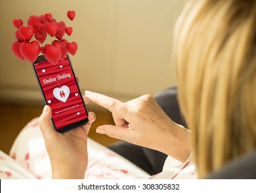 Modern Relationships Concept: Mature Woman With 3d Generated Touchscreen Smartphone With Online Dating On The Screen. Screen Graphics Are Made Up.