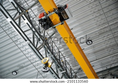 Modern remote control crane of a warehouse of a factory, inside