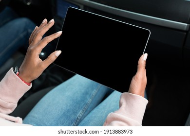 Modern Remote Work, Online Map, Travel Route In Trip. Young African American Lady Holds Tablet With Empty Screen In Hands, Surfing On Internet And Sits In Car, Cropped, Pov, Close Up, Free Space