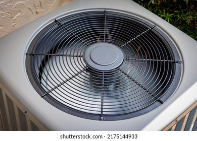 Modern residential HVAC air conditioner unit fan top view. - Shutterstock ID 2175144933