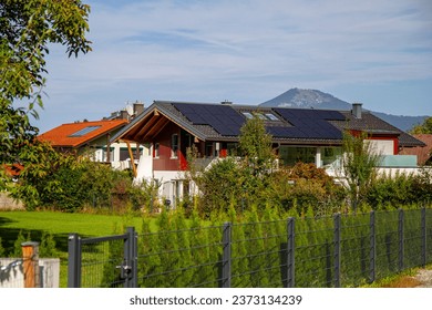 Modern residential park, design wooden cladding on the family house, solar panel - Powered by Shutterstock