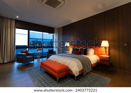 Modern retro bedroom interior with mid century decoration furniture and wall lamp.