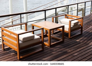 Modern Riverside Cafe With Wooden Sofa And Furniture