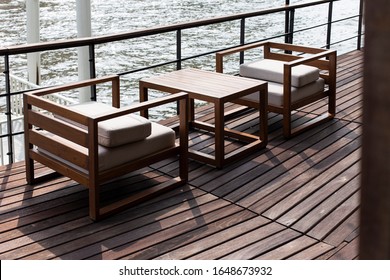 Modern Riverside Cafe With Wooden Sofa And Furniture