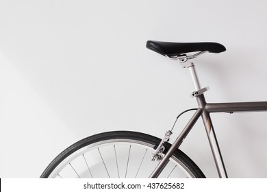 Modern road bicycle on white textured background
