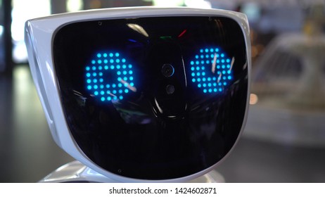 Modern Robotic Technologies. The Human Robot Looks At The Camera