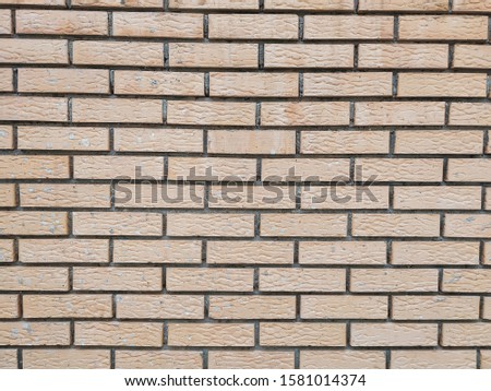Modern rock stone wall background made of bricks on a wall of the building with rough texture and interesting antique retro natural pattern