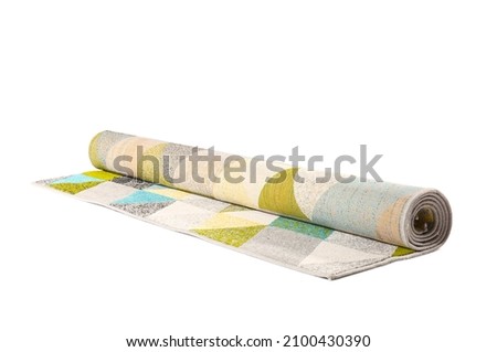 Modern rolled carpet on white background