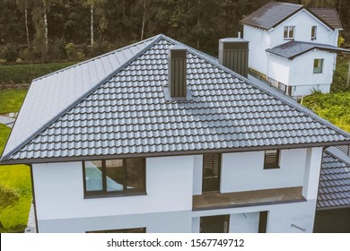 Modern roof made of metal. Corrugated metal roof and metal roofing.