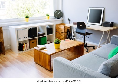 Modern Room, Home Office Interior. Room With Sofa, Desk, Chair, Small Table And Other Furniture