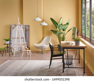 Modern room, home office style, table and computer, yellow background and lamp. - Powered by Shutterstock