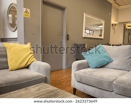 Modern room with sofas and mirror 
