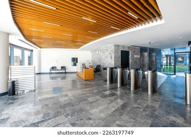 Modern round office building entrance with turnstiles