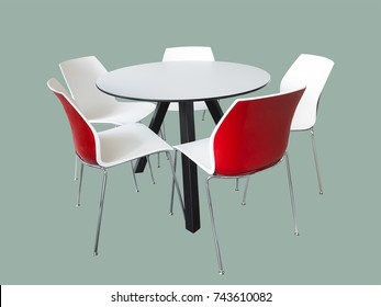 Modern round table with five chairs, isolated.