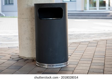 Modern Rubbish Bin On A Street In A Public Place. Warm And Sunny Day.