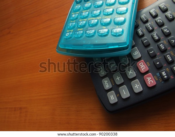 modern\
scientific calculator on the wooden\
table