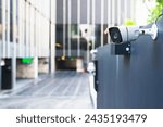 A modern security camera attached to a building