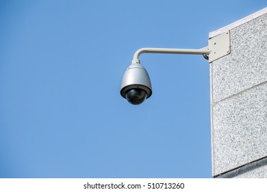 Modern security camera over blue sky background - Shutterstock ID 510713260