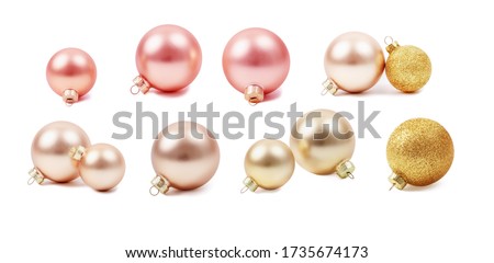 Modern set of glass Christmas toys. . New Year's glass balls. Pearl, pink and gold colors. Stock photo, isolated on white, side view.