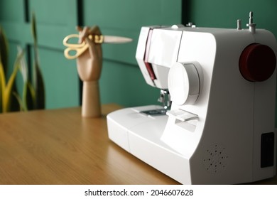 Modern Sewing Machine On Table, Closeup