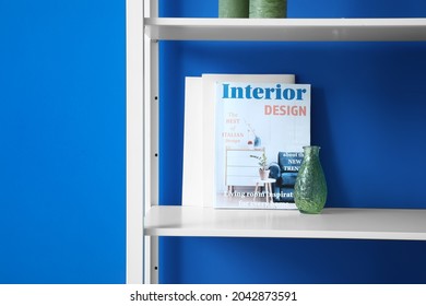 Modern Shelf With Magazine Near Color Wall, Closeup