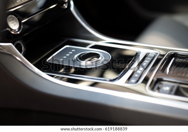 Modern shift gear in\
luxury car interior