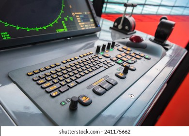 Modern ship control panel with radar screen, accelerator, trackball and keyboard