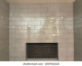 A Modern Shower With Glass Tile And Decorative Nicho