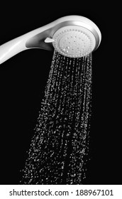 Modern Shower Head With Running Water Isolated On Black Background