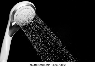 Modern Shower Head With Running Water Isolated On Black Background