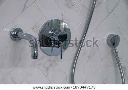 modern shower with water diverter in the bathroom