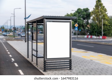 Modern Simple Bus Stop Station For Passengers In The City Street For Transportation Of People Around The Town With Bench And Roof