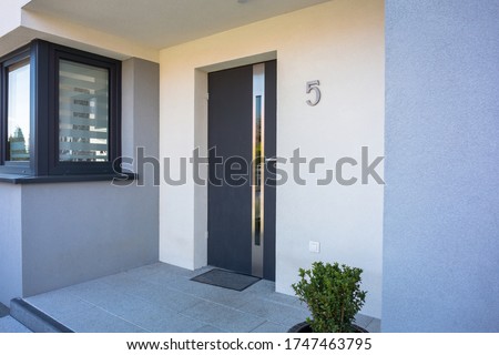 A modern single family house with a entrance doors