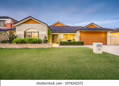 Modern single storey suburban home front elevation at twilight. PERTH, WESTERN AUSTRALIA. Photographed: April, 2018.