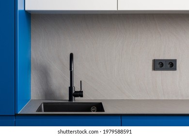 Modern Sink With Black Tap In New Designed Kitchen With Gray Countertop And Backsplash And Stylish Blue Cupboards