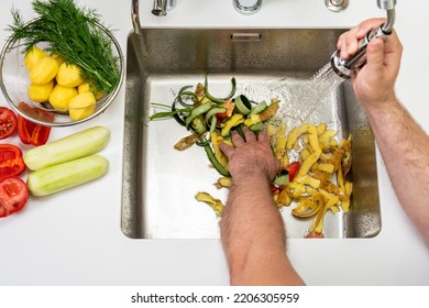 Modern sink with food waste in the hole of the disposer - Powered by Shutterstock