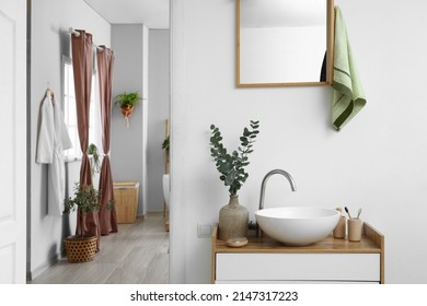 Modern sink, towel and mirror in bathroom - Powered by Shutterstock