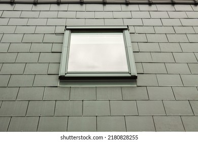 Modern skylights on a green roof. Construction of a roof with roof windows in the attic. Close-up view of dormer roof window. - Shutterstock ID 2180828255