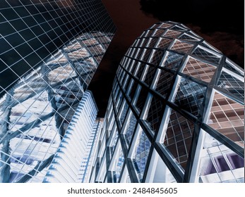 modern skyscraper, emphasizing its height and  impressiveness. The clean lines of the steel and glass facade reach  up towards the sky, dwarfing the people below.