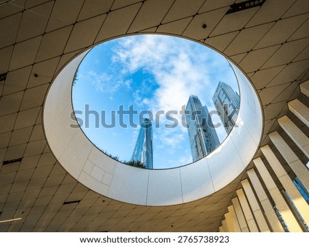 Modern Skyscraper Framed by Circular Canopy at Barangaroo Waterfront in Sydney Australia