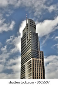 Modern skyscraper  with moving clouds