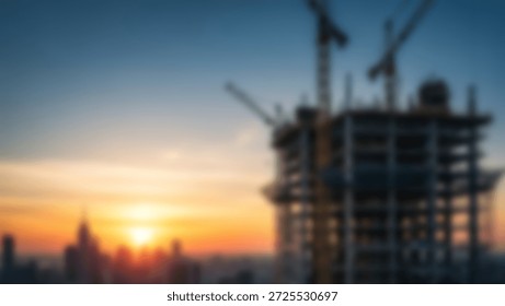 A modern skyscraper under construction at sunset, with city skyscrapers and cranes visible in the background.