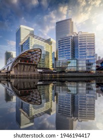 The modern skyscrapers of the financial district Canary Wharf in London, UK, on a sunny day with reflections in the water