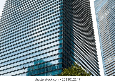 Modern Skyscrapers in Singapore’s Urban Jungle with Suspended Window Cleaner – A Striking View of Contemporary Architecture, Urban Life, and Dynamic Cityscapes - Powered by Shutterstock