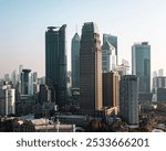 The modern skyscrapers in the Wuhan Central Financial District are illuminated by bright sunlight