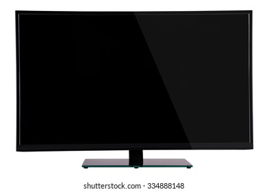 Modern Slim Plasma TV On Black Glass Stand Isolated On A White Background, Is Deployed To The Viewer