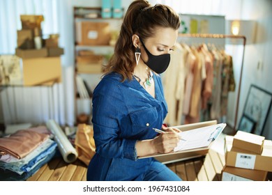 Modern Small Business Owner Woman With Black Mask In The Office.