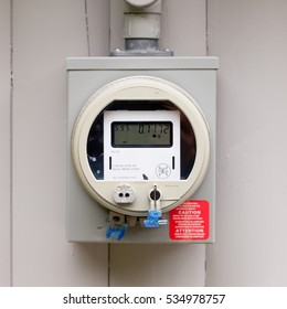 Modern Smart Grid Residential Digital Power Supply Meter Mounted Outside On House Wall